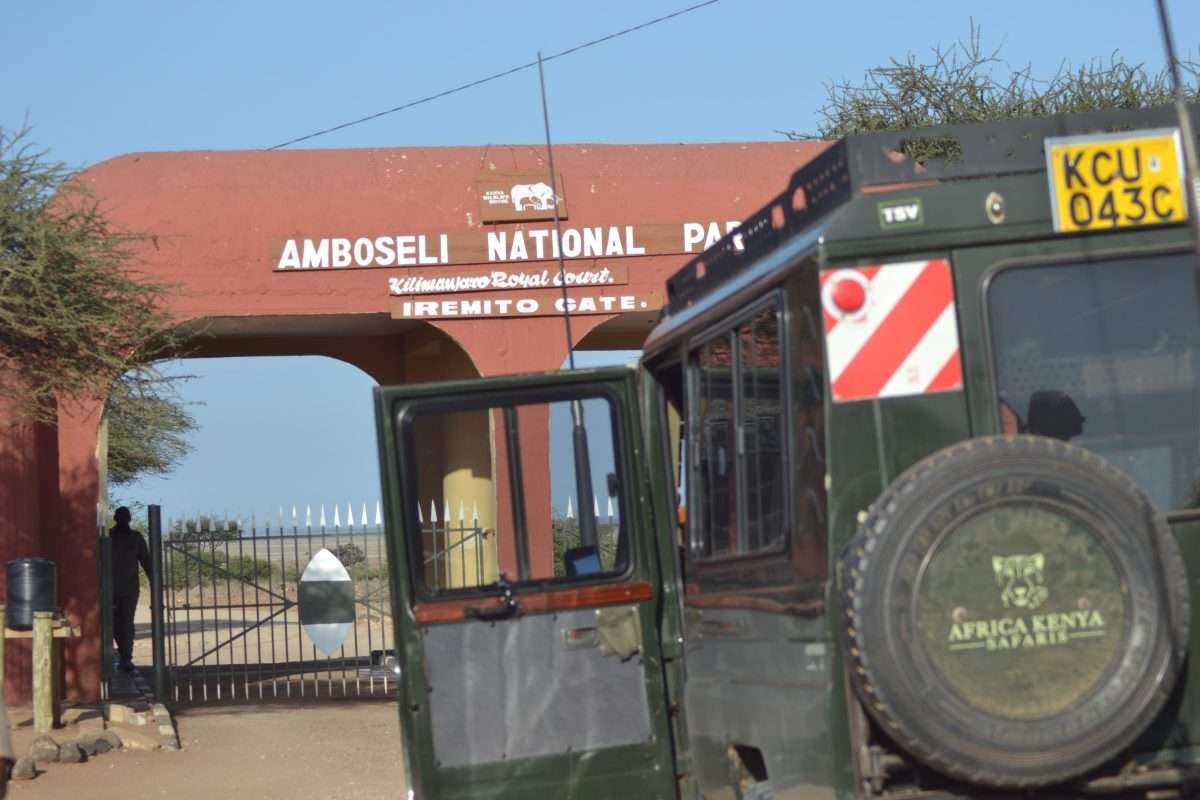 An Aether safari collection safari jeep at the Iremito Gate entrance to Amboseli National Park