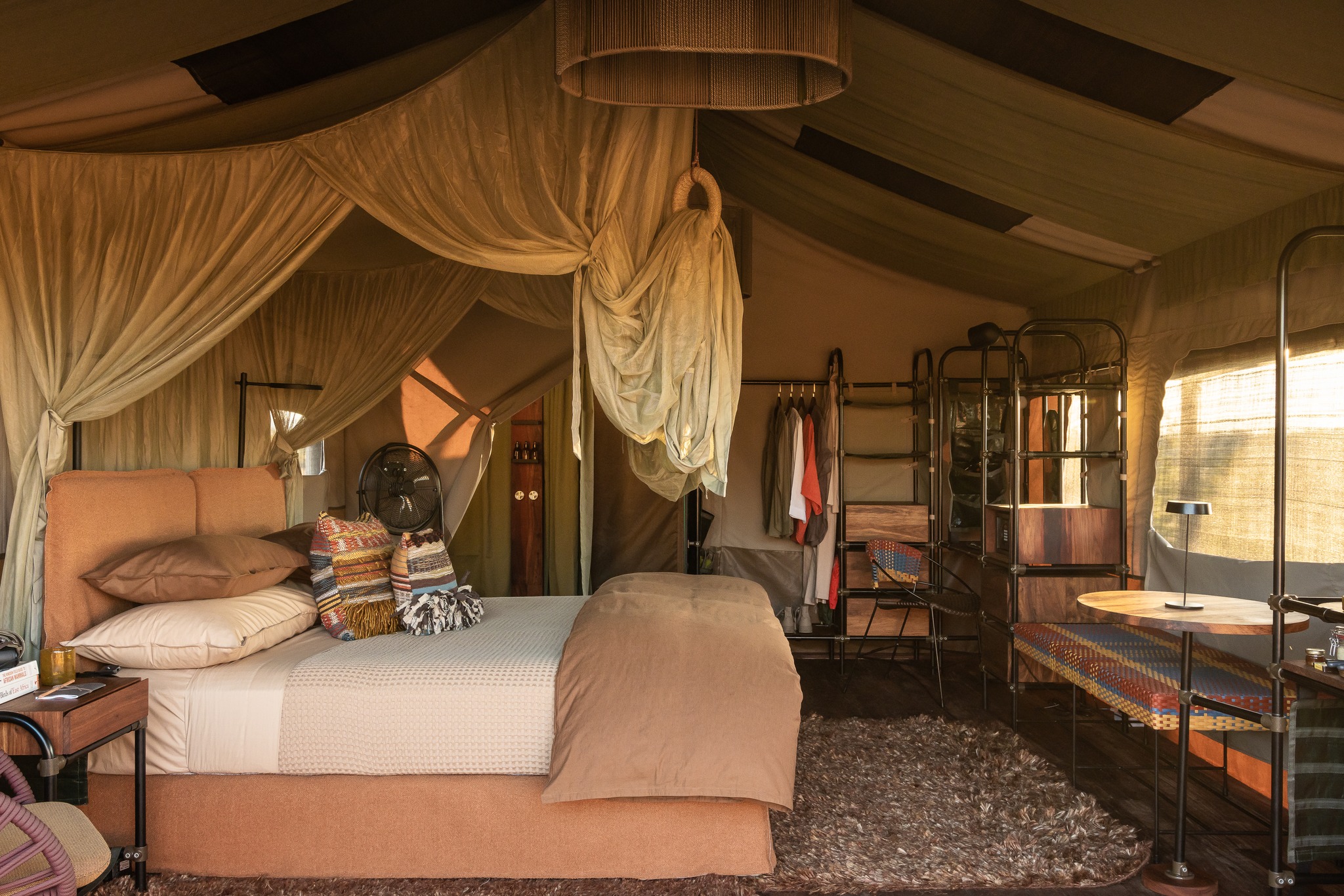 Interior of a luxury safari tent with a canopied bed