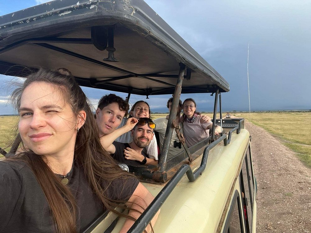 Group of guests in a safari vehicle on the plains