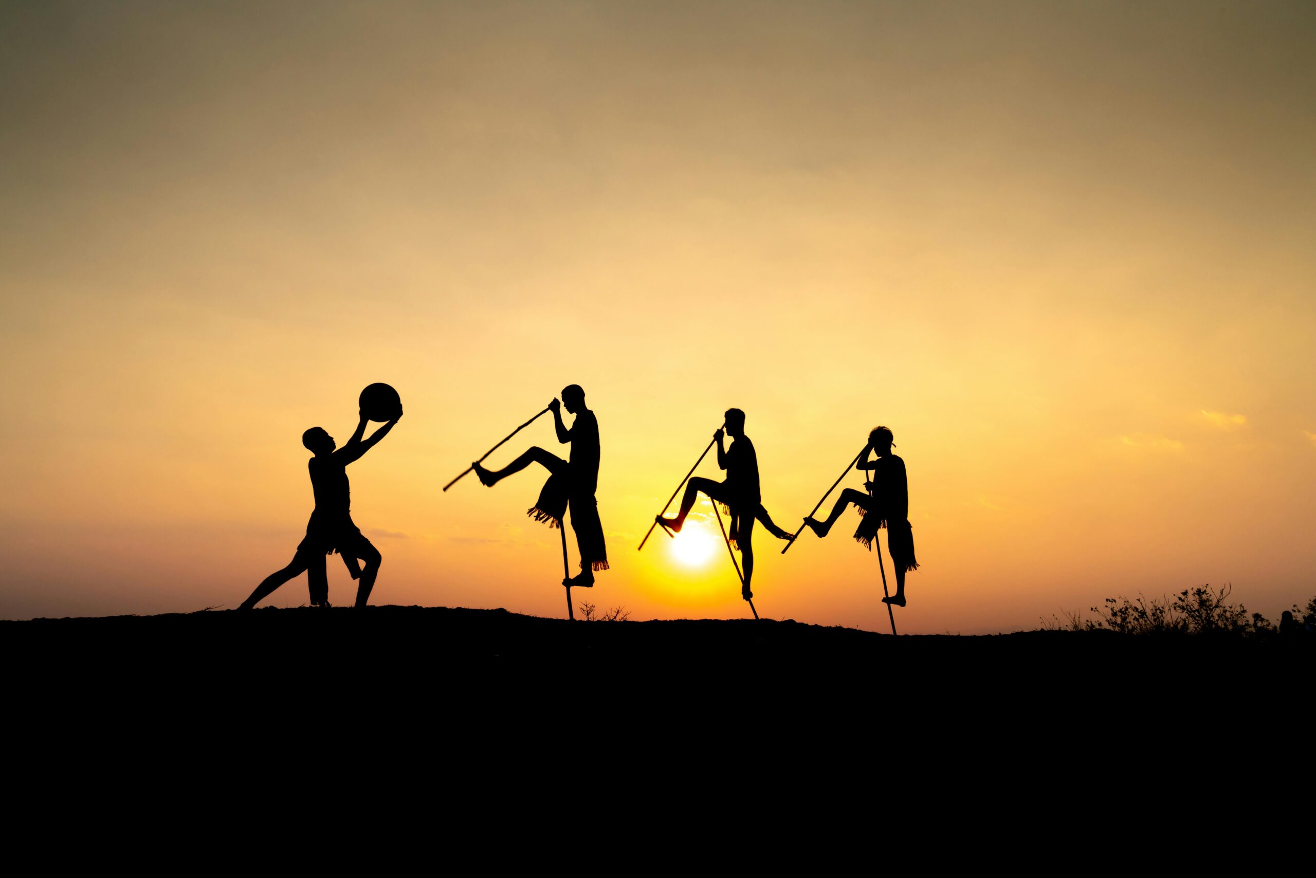 Maasai warriors performing the jumping dance at sunset