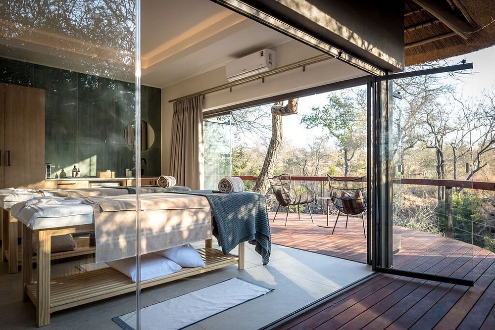Lodge bedroom opening onto a private deck