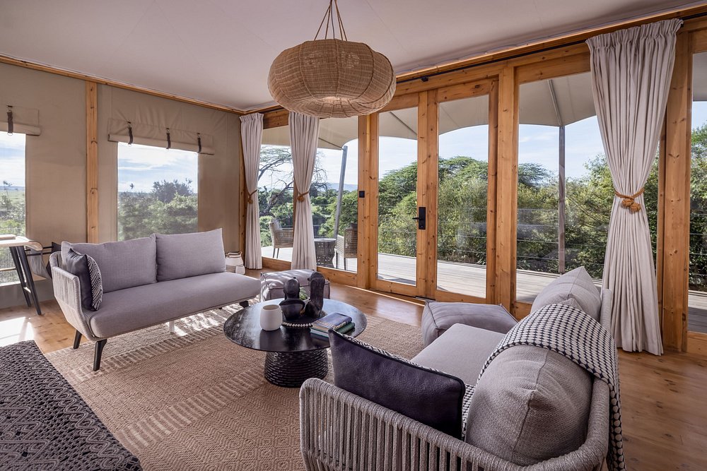 Lodge sitting room with sofas and wide windows