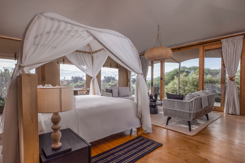 Tented suite with a four-poster bed and mosquito net