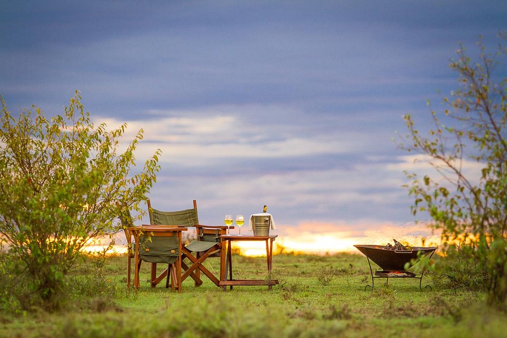 Bush dinner table set on the plains at sunset